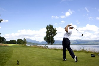 Golfer at Loch Lomond, Scotland.