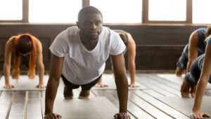 Male male practising yoga or Pilates